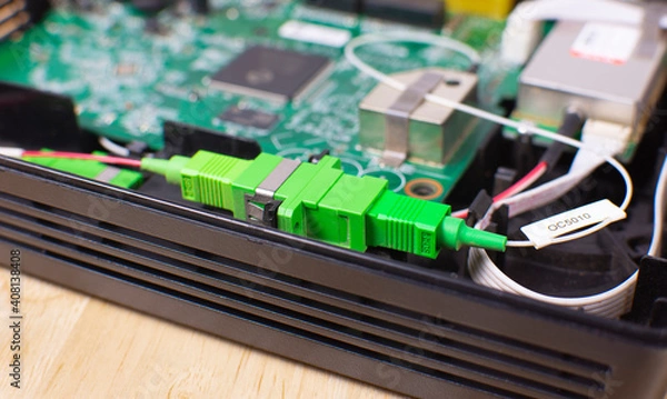 Obraz Fibre optic connector socket inside a wireless modem router