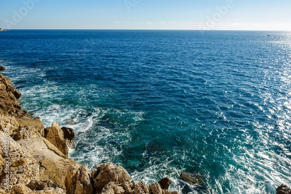 Fototapeta waves crashing on rocks