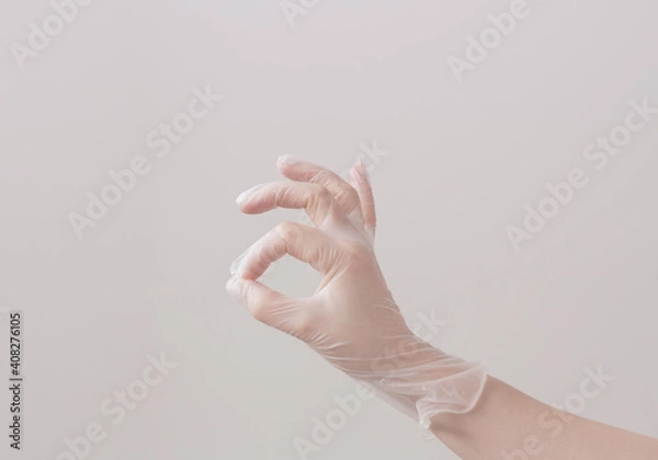 Obraz Hand in vinyl glove. Image in pastel colors