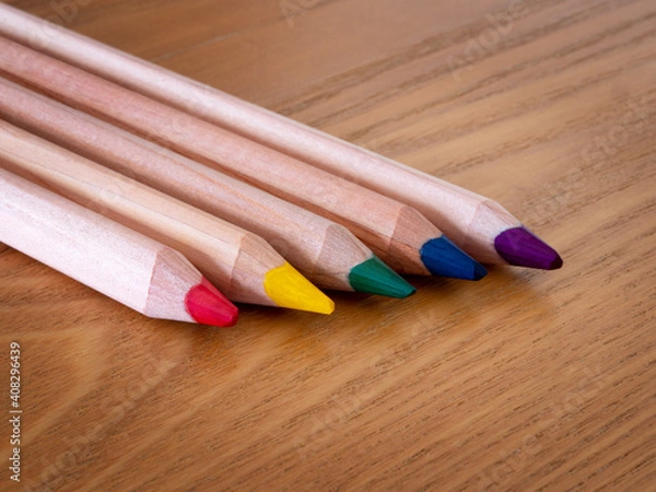 Obraz Five different coloured pencils on a wooden table