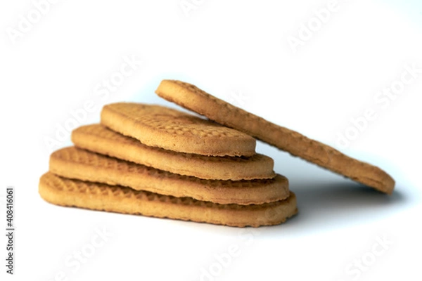 Fototapeta Stack of textured brown cookies isolated on white background