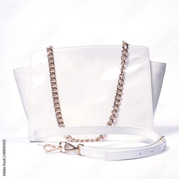 Obraz White women's handbag with a chain..