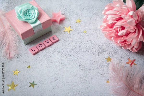 Fototapeta Top view on a table with present and decorations. Word love made of wooden letters