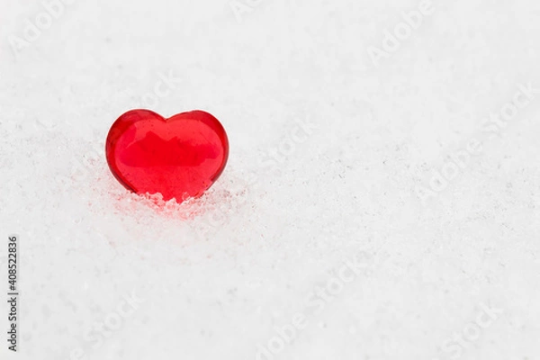 Fototapeta Little red heart in the snow (valentine's day greeting card, selective focus)