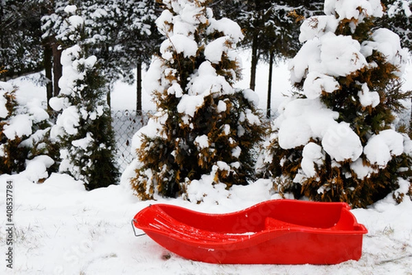 Obraz View of a red sledge in a winter landscape