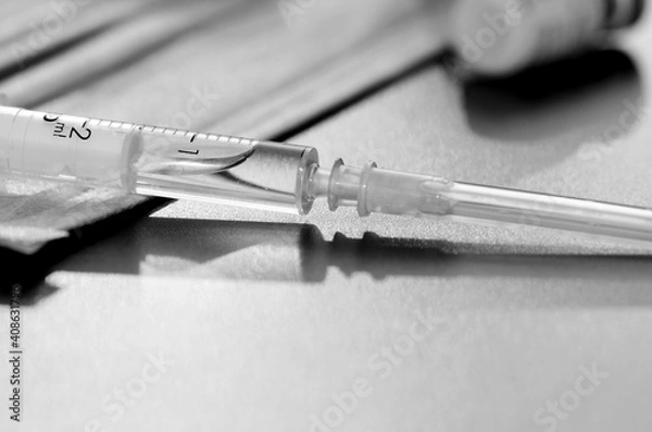 Obraz Coronavirus vaccine with syringe drugs for the design of information materials on the benefits of vaccination against viral diseases, thermometer and medical mask are the main working tools a doctor