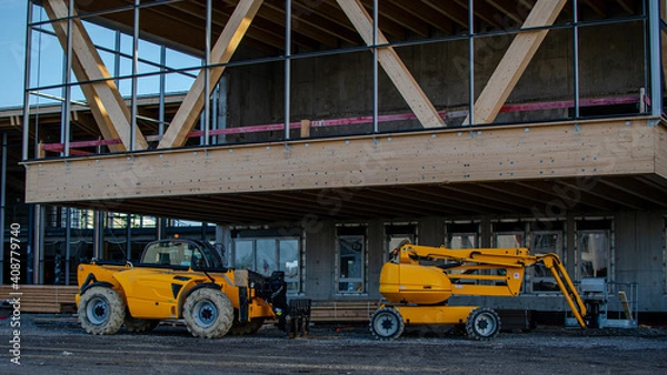 Obraz Vendée, France; January 17, 2021: a telescopic cart and a nacelle on the construction site of the future high school of Saint Gilles Croix de Vie.