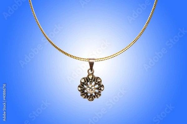 Obraz Golden jewellery against gradient background