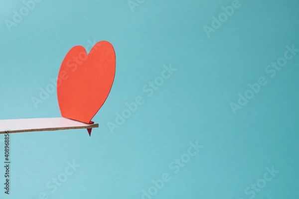 Fototapeta Loneliness concept with red heart shape alone