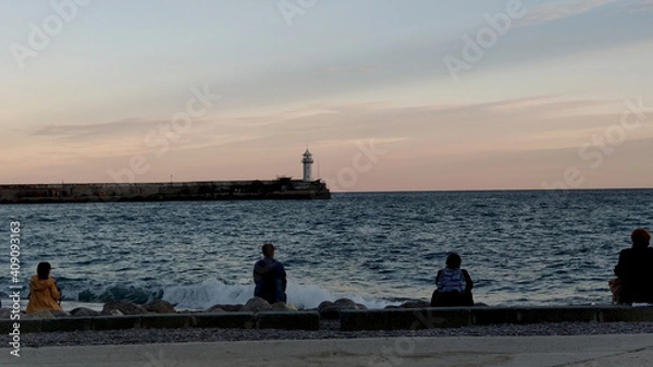 Fototapeta Crimean peninsula, southern coast. On the evening embankment of the city of Yalta.