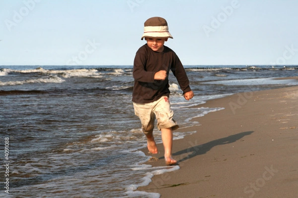 Obraz little boy on a beach