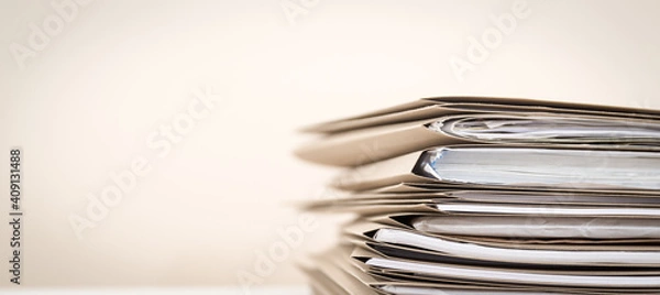Fototapeta Extremely Close up Stack of Documents Folders on Office Desk Waiting to be Completed