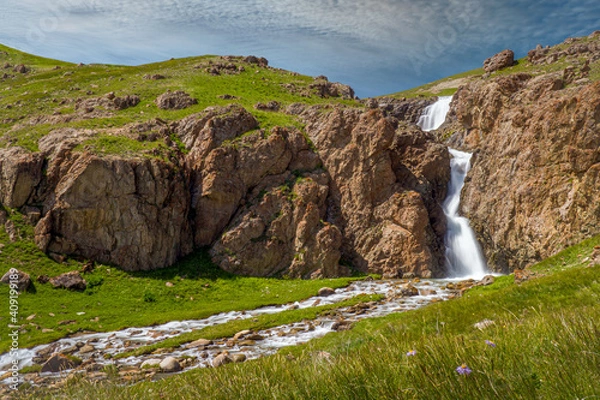 Obraz Waterfall in the mountains on a clear day.