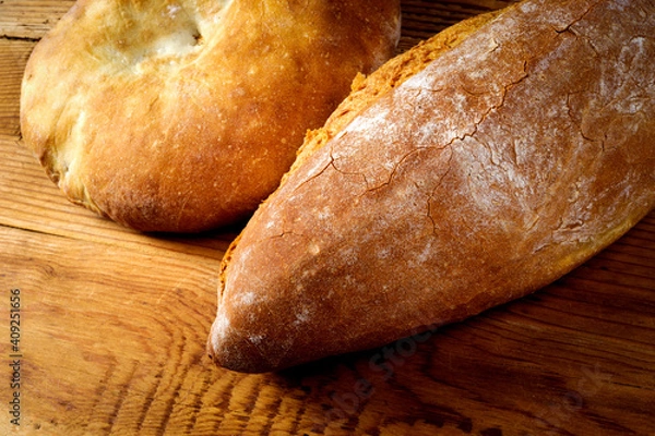 Obraz Round loaf and bread on wooden table