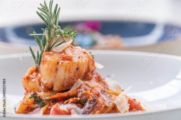 Fototapeta Spaghetti with prawns, sea scallops and parmesan
