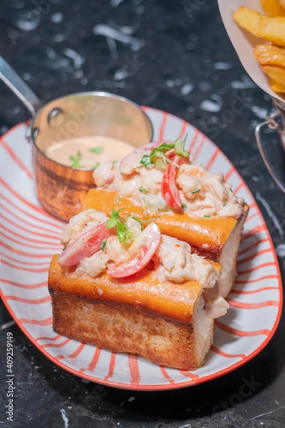 Fototapeta Lobster Roll.fresh Maine Lobster boiled, mixed with mayo, celery, chives served in toasted hero roll with crisp lettuce and drawn butter.
