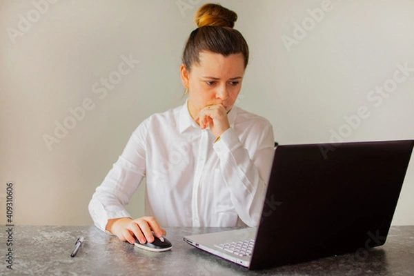 Fototapeta Office worker girl thinks over the project