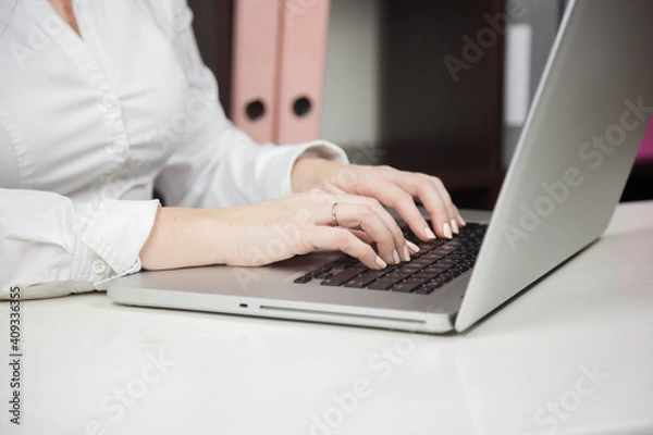 Obraz Work from home, e-learning, online learning concept. Close-up, business woman working, hand typing on laptop computer, searching the internet at the table in modern home office. Student studying at ho