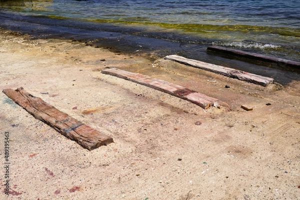 Obraz boards on the beach on the way to the water