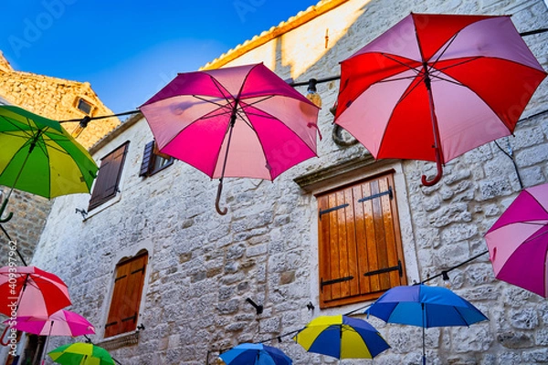 Obraz Decorative umbrellas to fight the sun in the courtyard