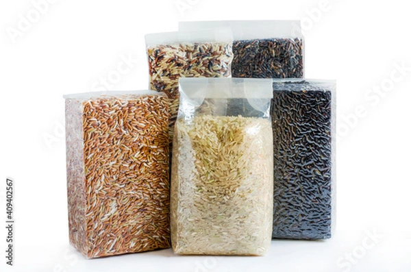 Obraz Group of organic rice seeds in plastic or vacuum package on white background