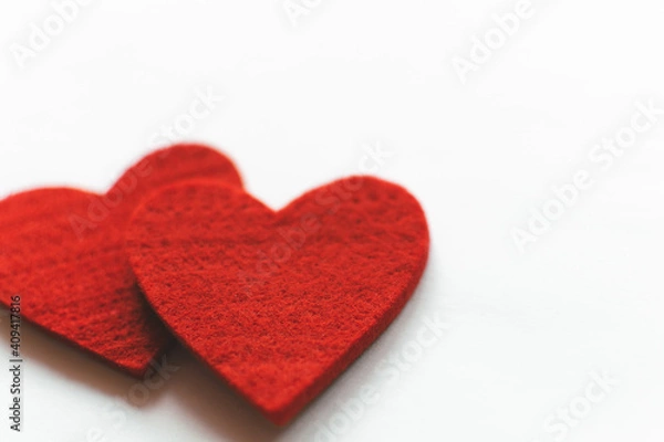 Fototapeta Red felt hearts on a white background. Valentine's Day