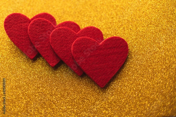 Obraz Red felt hearts on golden shiny background. Valentine's Day