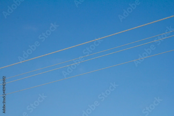 Obraz Four thin straight lines on a blue background