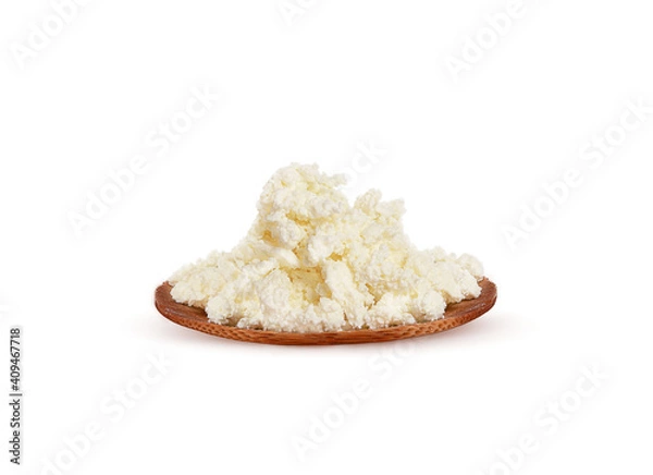 Obraz fresh cottage cheese on a wood plate on a white background