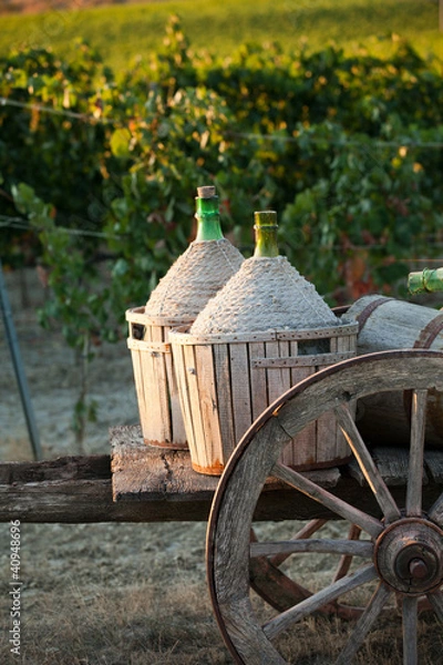 Fototapeta A cart loaded with wine bottles
