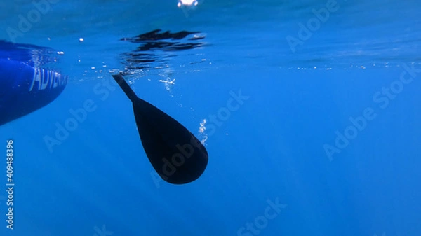 Fototapeta Side view of rowing oar underwater