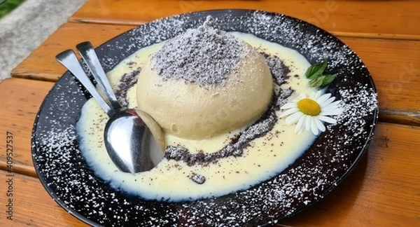 Fototapeta Germknödel - sweet Austrian dumpling filled with jam served with vanilla sauce, poppy seeds and butter