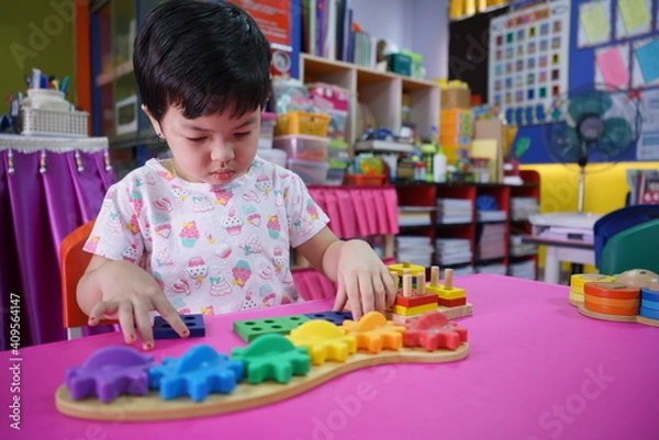 Fototapeta child playing with blocks