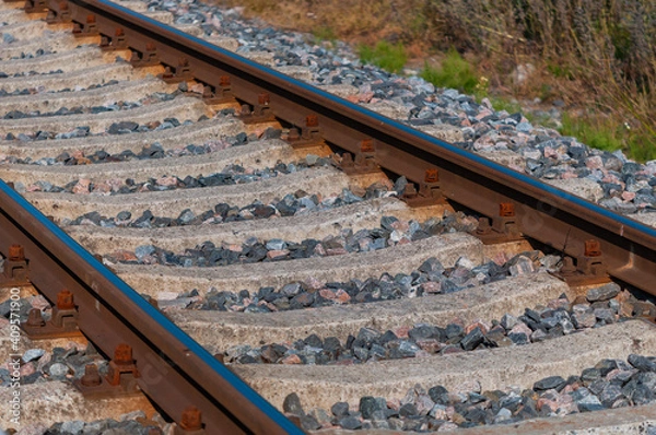 Fototapeta rails on concrete sleepers on a stone base