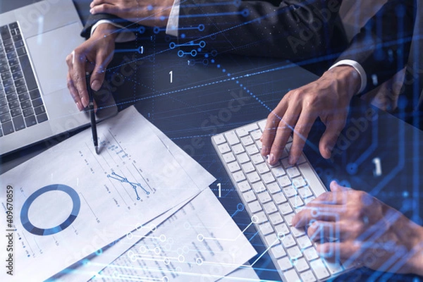 Fototapeta Two research and development specialists man and woman working on project to create a new approach to develop software to improve business. Technological icons over the table with document.