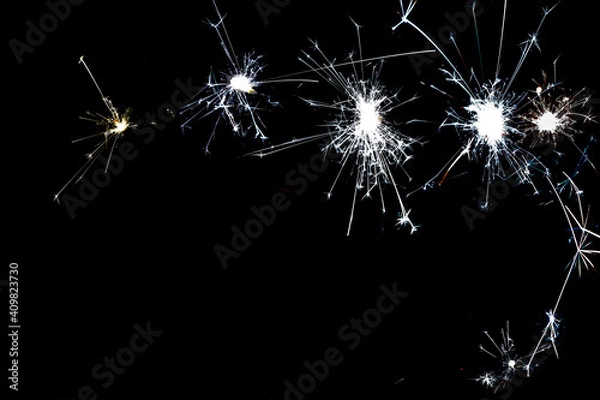 Fototapeta cold silver sparkles on a black background close-up