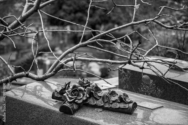 Obraz Crucifix with roses on a grave
