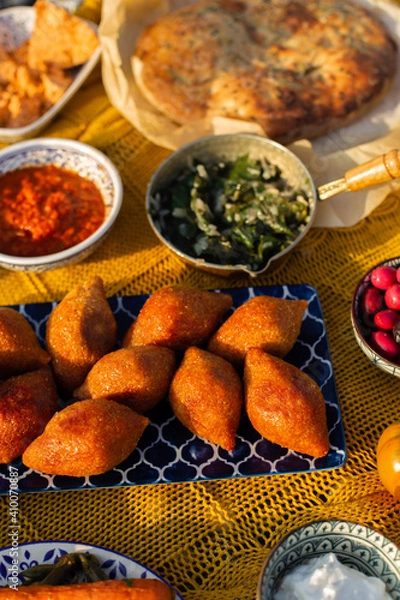Obraz Middle eastern table with stuffed meatballs with bulgur