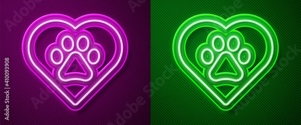 Obraz Glowing neon line Heart with animals footprint icon isolated on purple and green background. Pet paw in heart. Love to the animals. Vector.