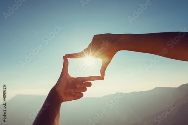 Obraz close up hand framing looking view sunrise