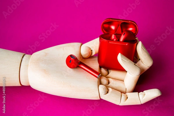 Obraz Wooden hand with headphones in a red box