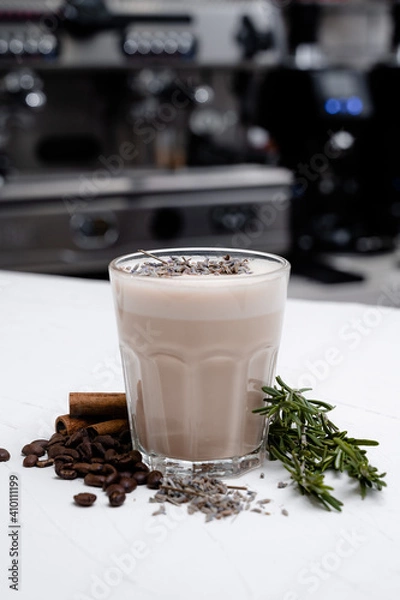 Obraz Mocha with coffee beans on white table over natural interior.