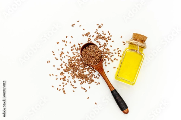Obraz Flax seeds in a spoon and bowl with a bottle of flaxseed oil