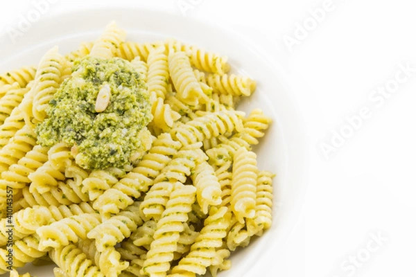 Obraz Pasta with pesto, basil leaves with white background
