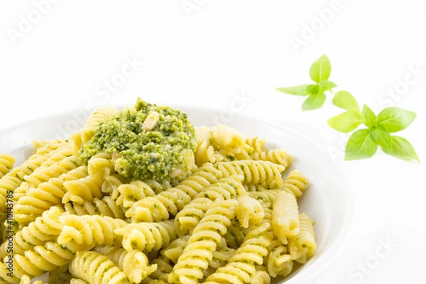 Obraz Pasta with pesto, basil leaves with white background
