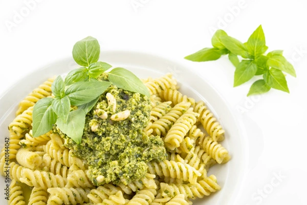 Obraz Pasta with pesto, basil leaves with white background