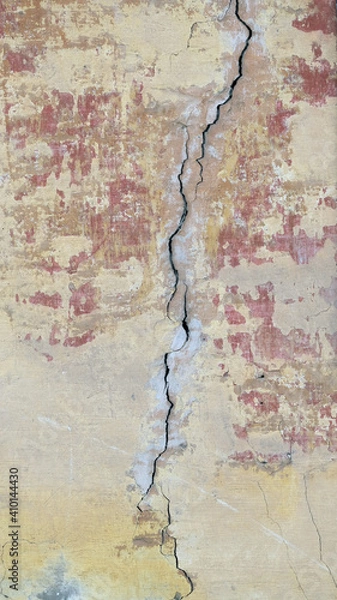 Fototapeta The old wall of the house. Crack. Plaster.
