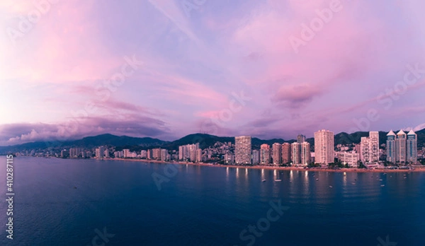 Obraz Beautiful sunset, aerial view of the beach, acapulco city seen from above. Travel and vacation concept. Colorful sunset on the beach
