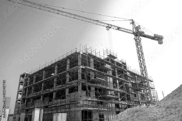 Obraz under construction building with tower crane