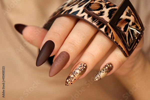 Obraz Luxurious multicolored manicure with animal design on long nails.